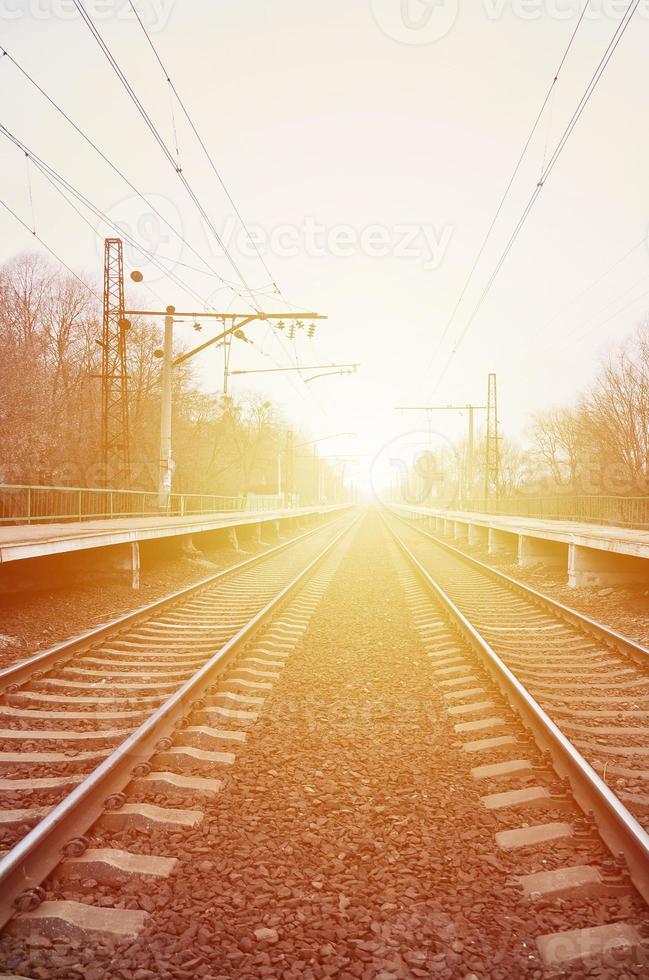 A railway station with platforms for waiting for trains photo