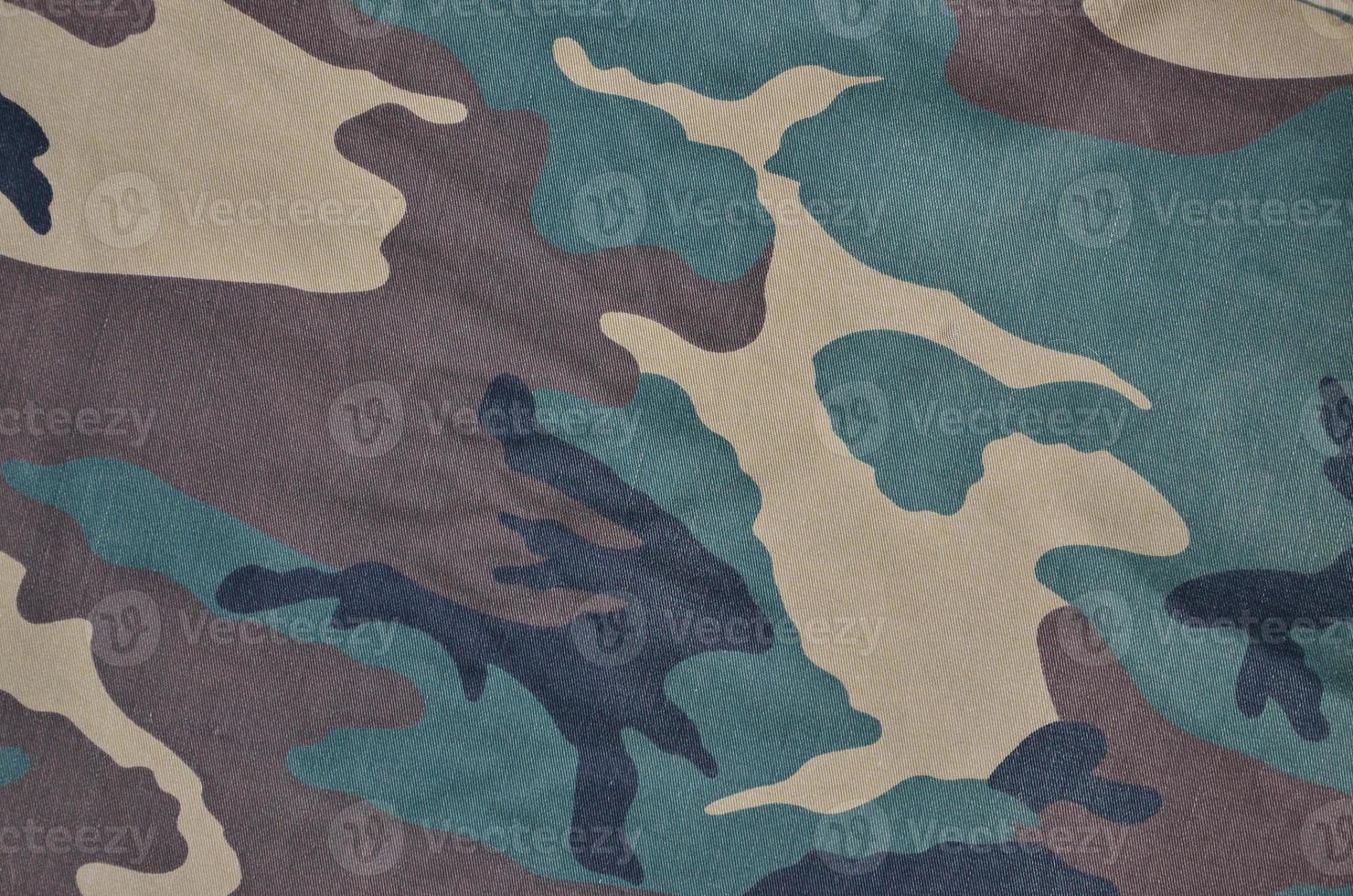 Textile pattern of military camouflage fabric photo