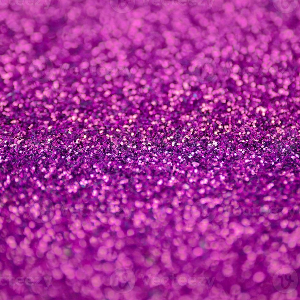 Pink decorative sequins. Background image with shiny bokeh lights from small elements photo