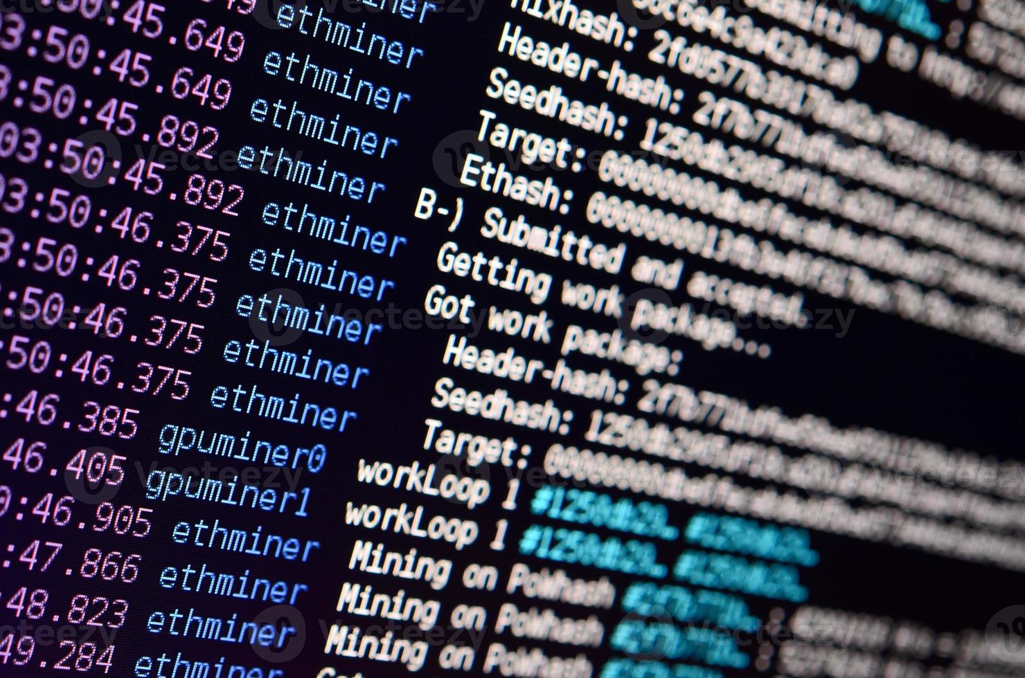 Macro snapshot of the program interface for crypto currency mining on the monitor of an office computer. The concept of mining bitcoins. The flow of information strings and data photo