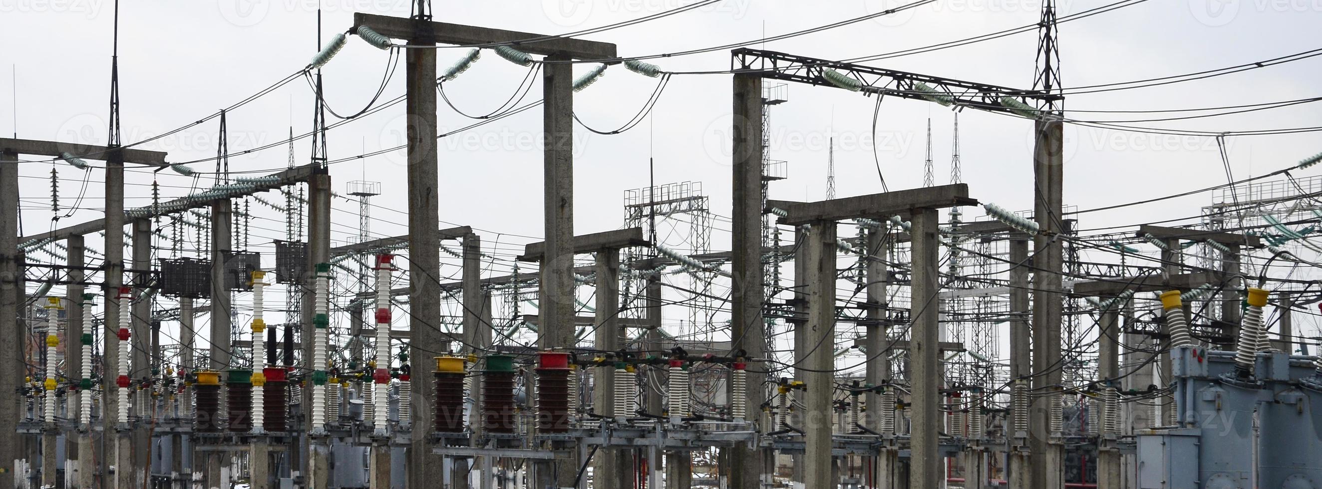 Power plant is a station of transformation. A lot of cables, poles and wires, transformers. Electro-energy. photo