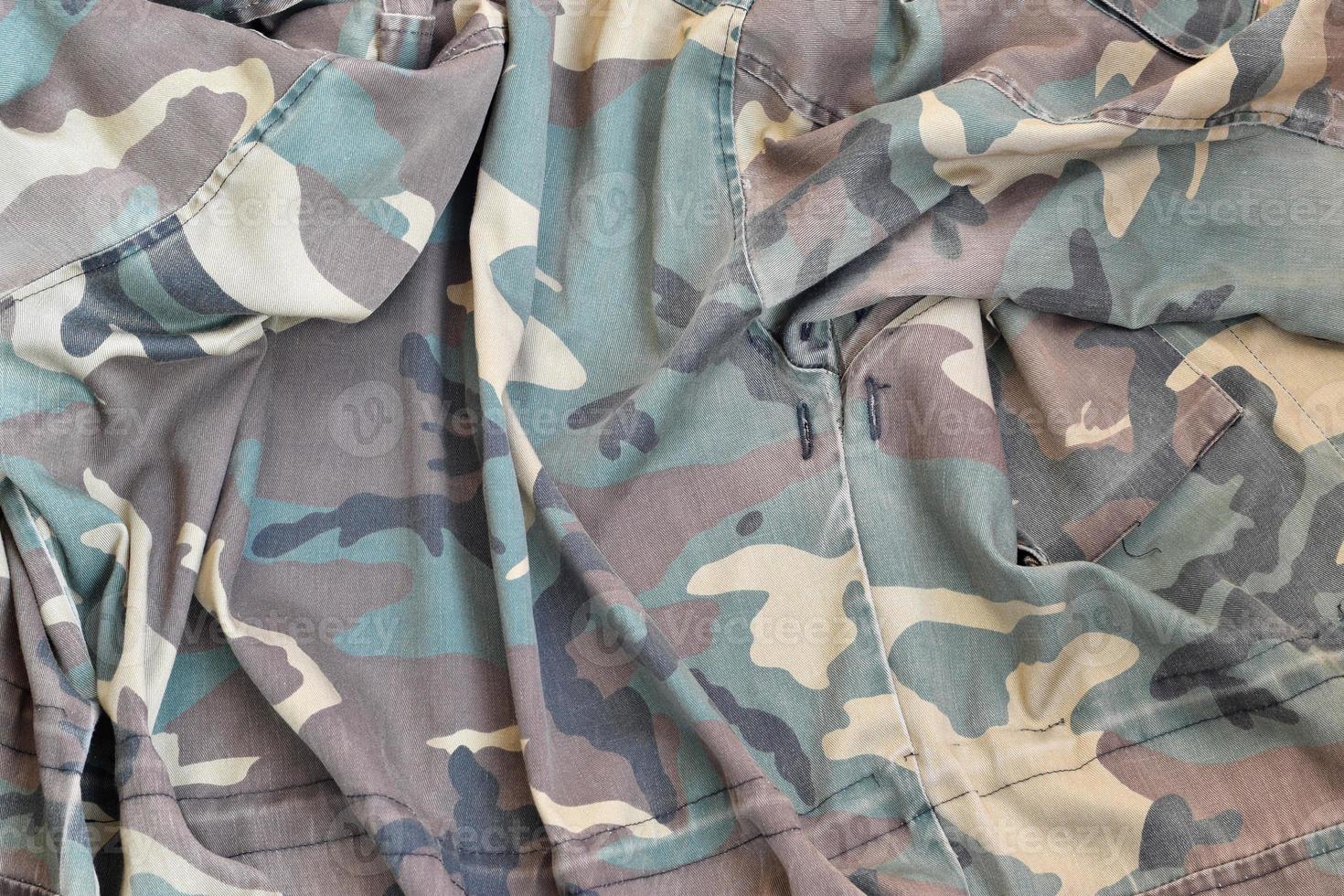 Camouflage background texture as backdrop for paintball and airsoft strikeball design projects photo
