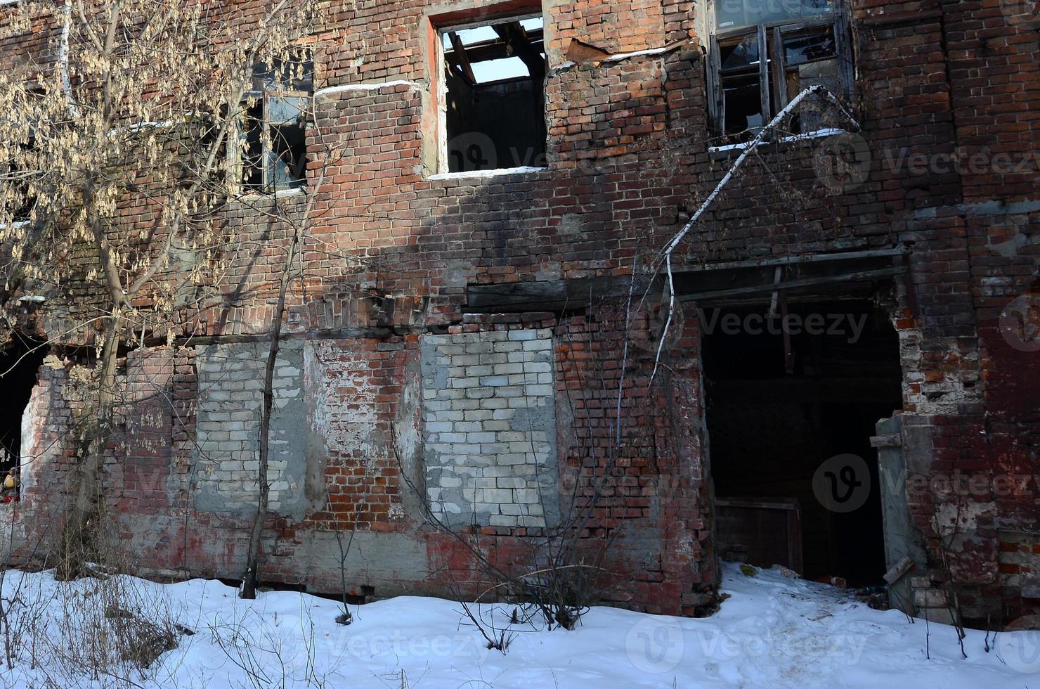 Fragment of an abandoned two-story building after military operations in Donetsk photo