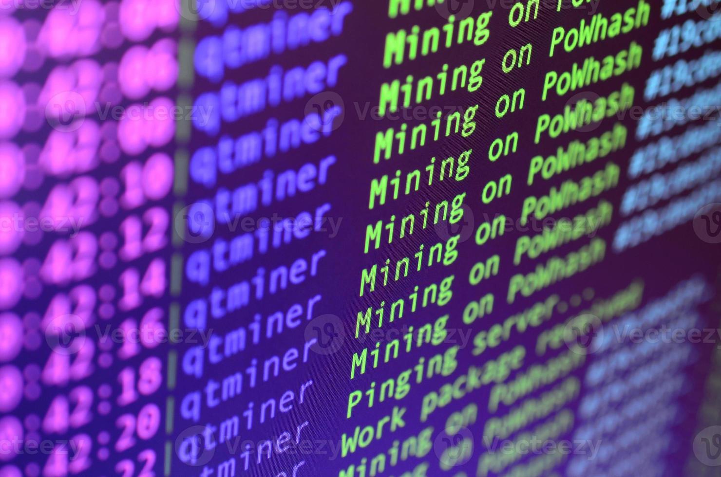 Macro snapshot of the program interface for crypto currency mining on the monitor of an office computer. The concept of mining bitcoins. The flow of information strings and data photo