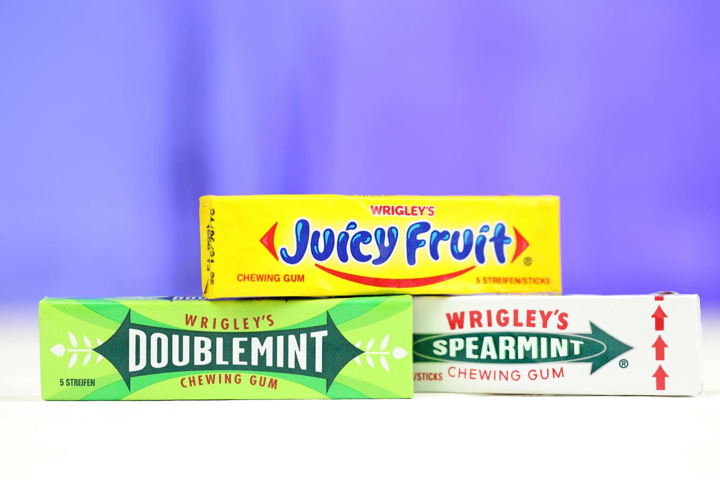 KHARKOV, UKRAINE - FEBRUARY 14, 2021 Wrigleys Spearmint Doublemint and Juicy Fruit chewing gum in classic design photo