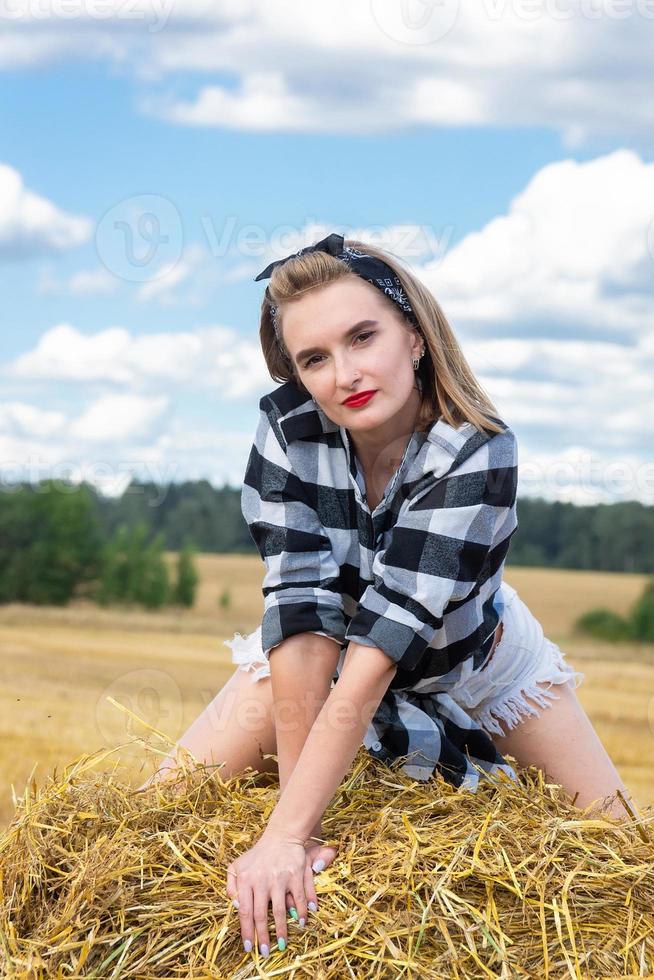 girl on a sheaf of hay photo