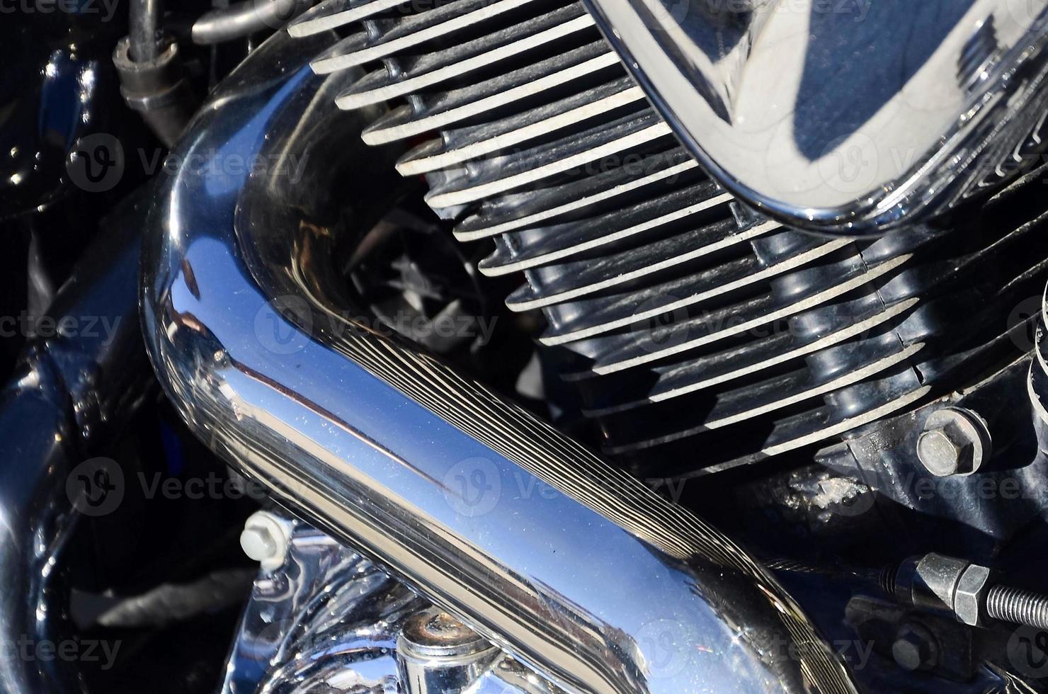 Fragment of chromed shiny body part of old classic motorbike photo