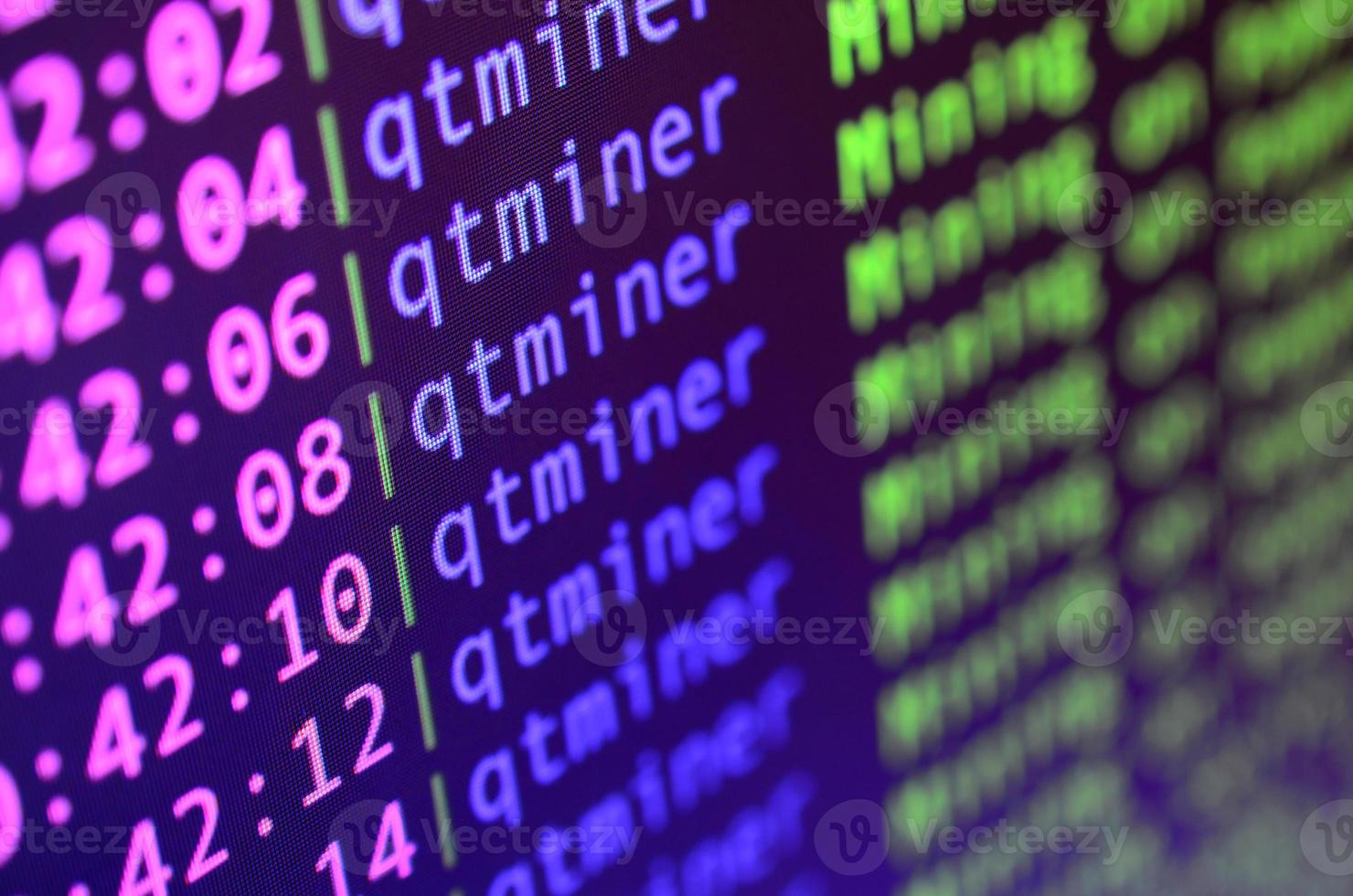 Macro snapshot of the program interface for crypto currency mining on the monitor of an office computer. The concept of mining bitcoins. The flow of information strings and data photo