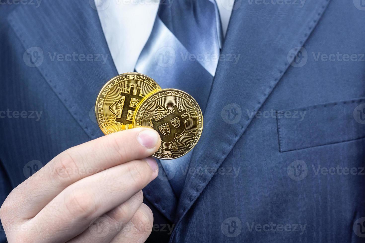 bitcoin  hand of a businessman photo