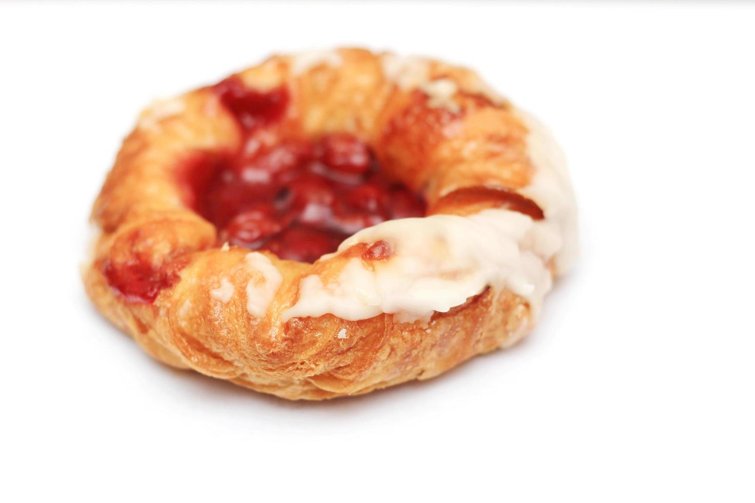 Cherry filled Danish or Danish bread placed on a white background. photo