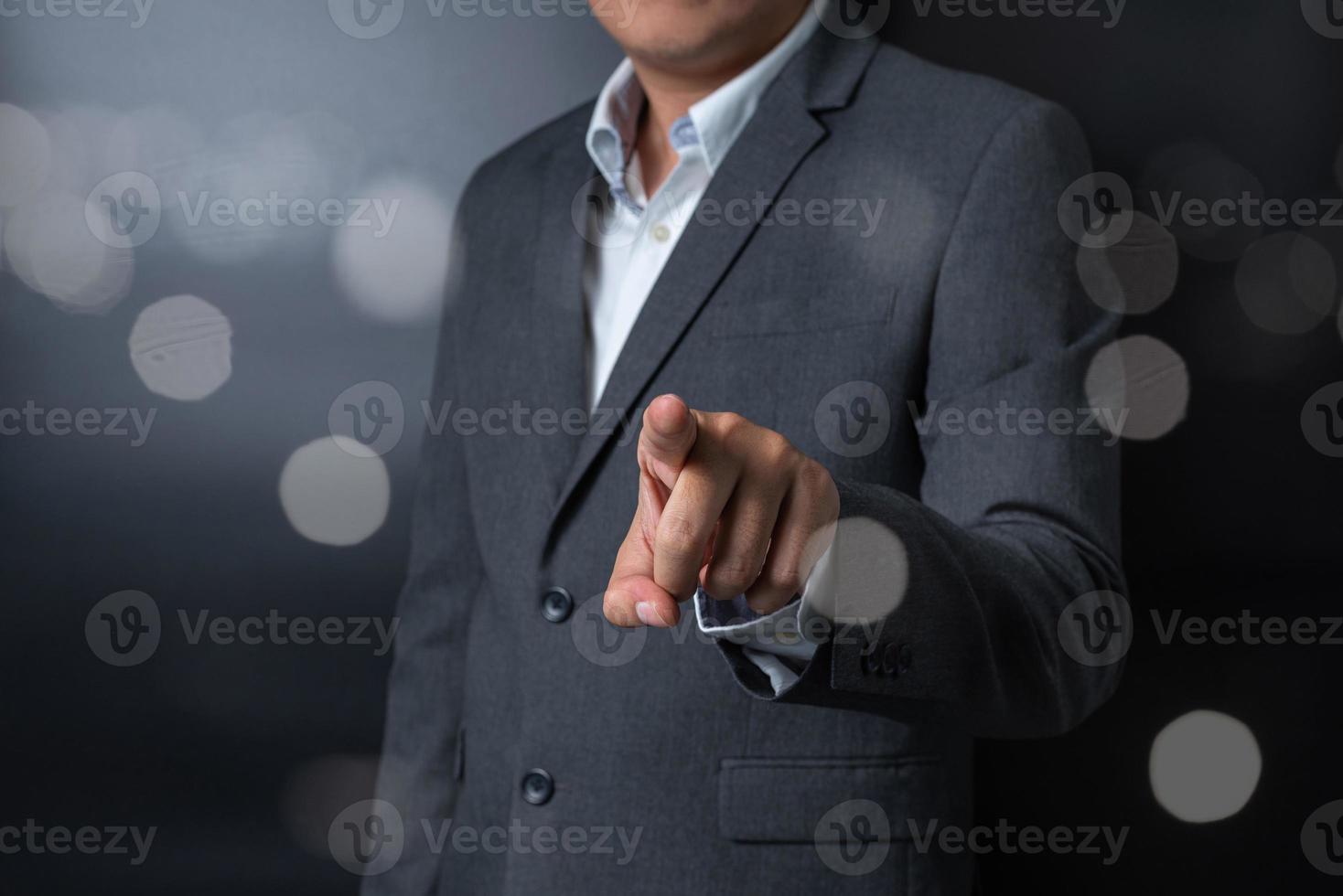 Double exposure of close up businessman pushing, touching on black and gray background photo
