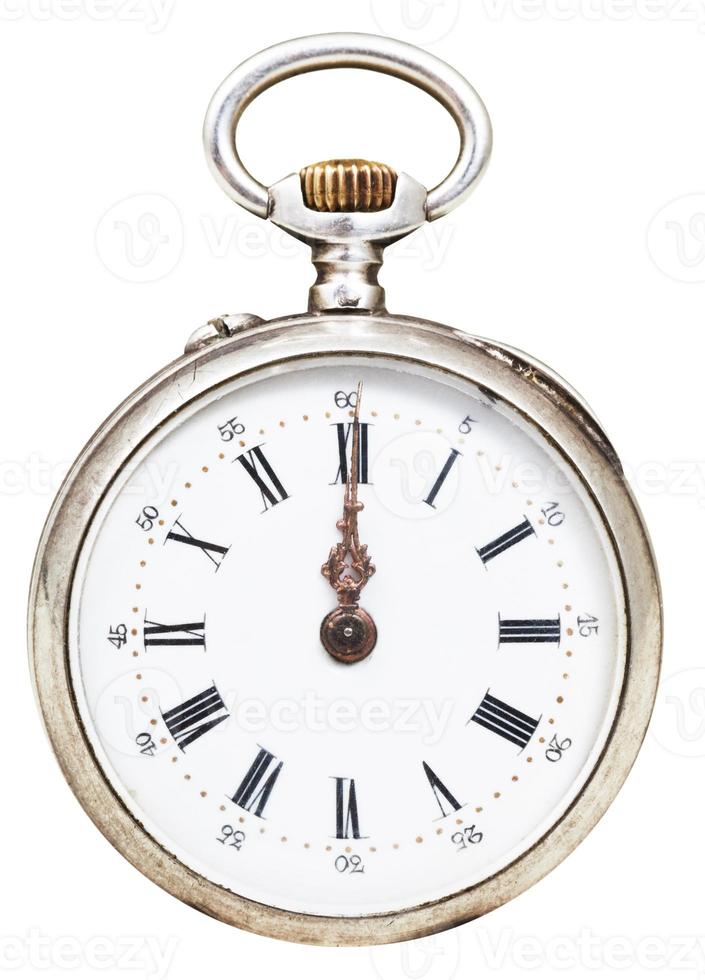 twelve o'clock on the dial of retro pocket watch photo