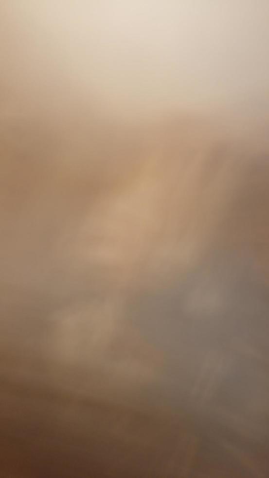 Abstract blur background with gray-brown, black, white, red and earth tones. photo