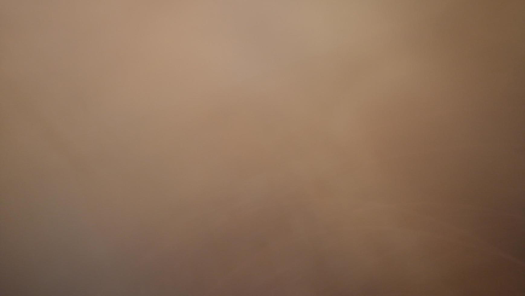 Abstract blur background with gray-brown, black, white, red and earth tones. photo