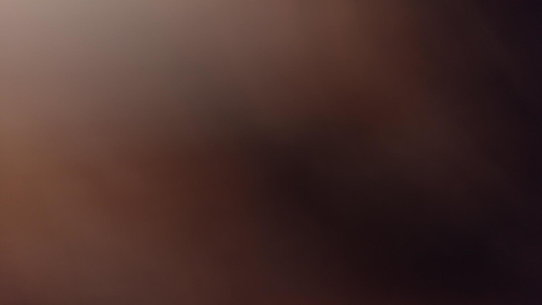 Abstract blur background with gray-brown, black, white, red and earth tones. photo