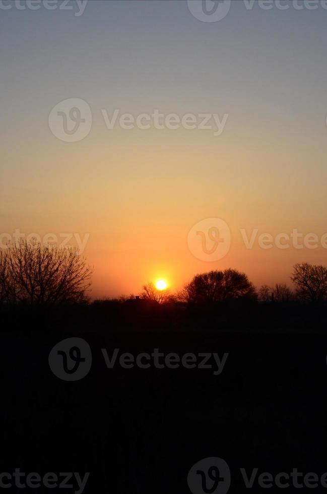 Dawn in the village. Sunrise in the suburban landscape photo