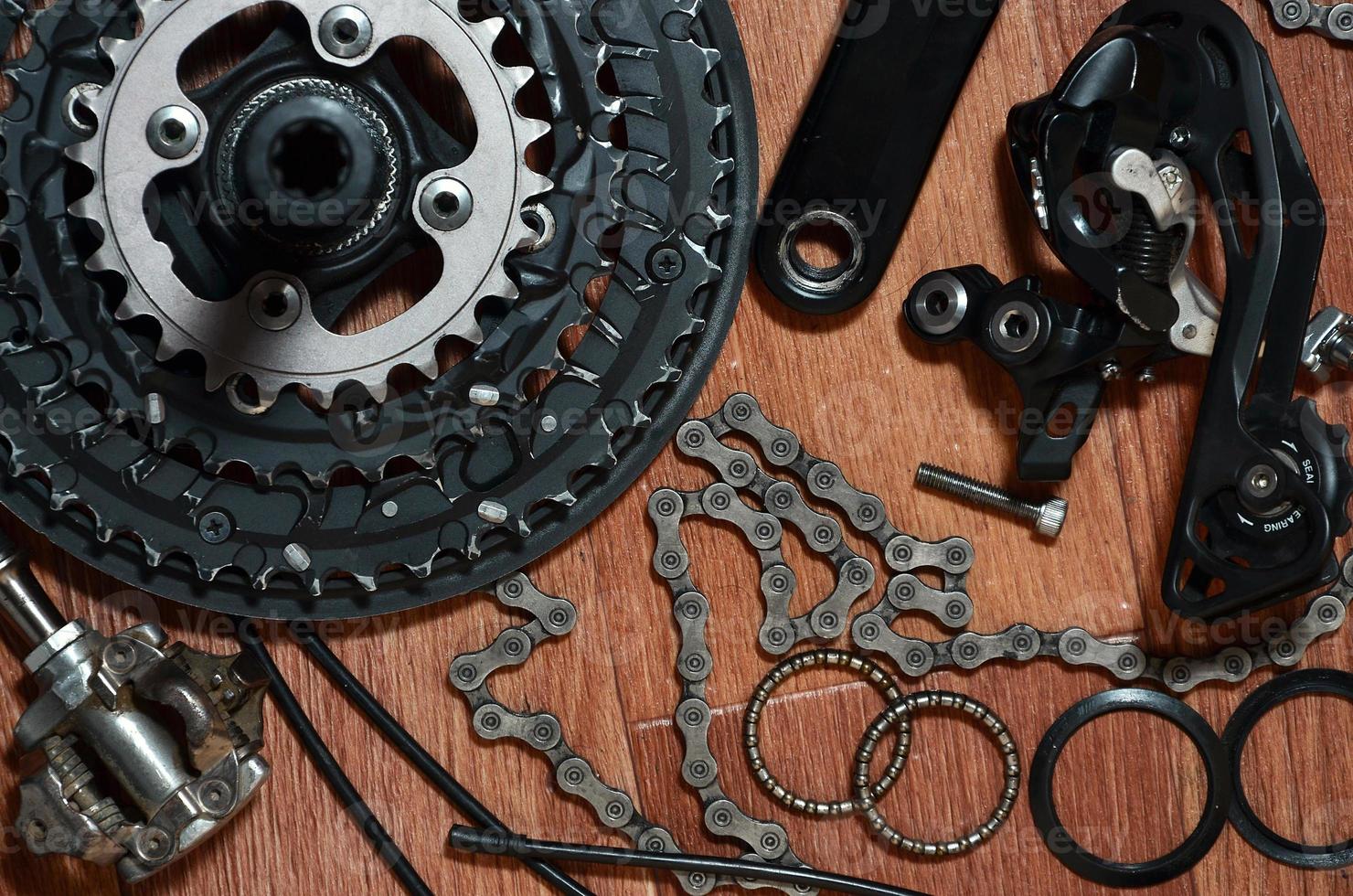 Many different metal parts and components of the running gear of a sports bike photo