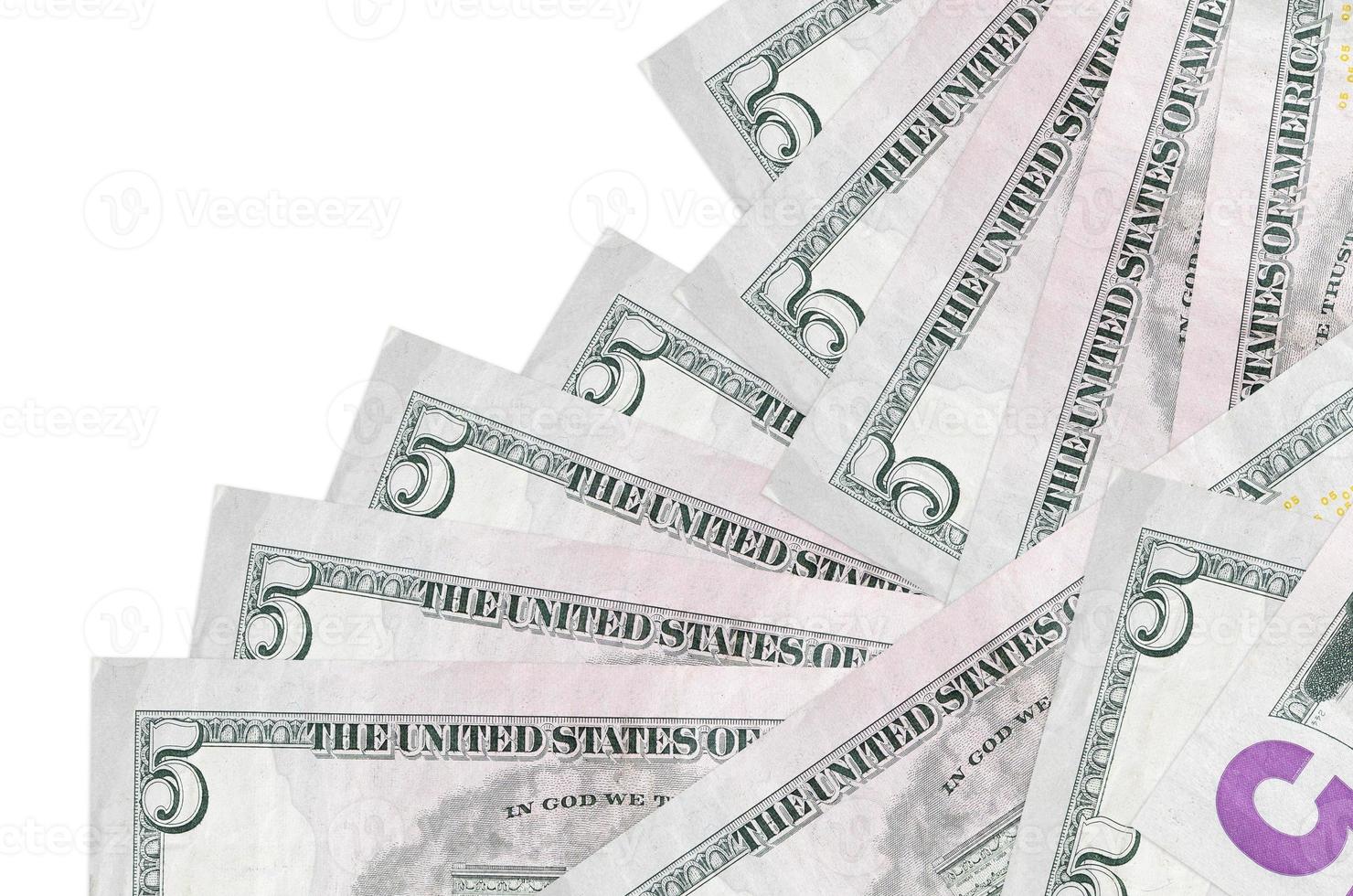 5 US dollars bills lies in different order isolated on white. Local banking or money making concept photo