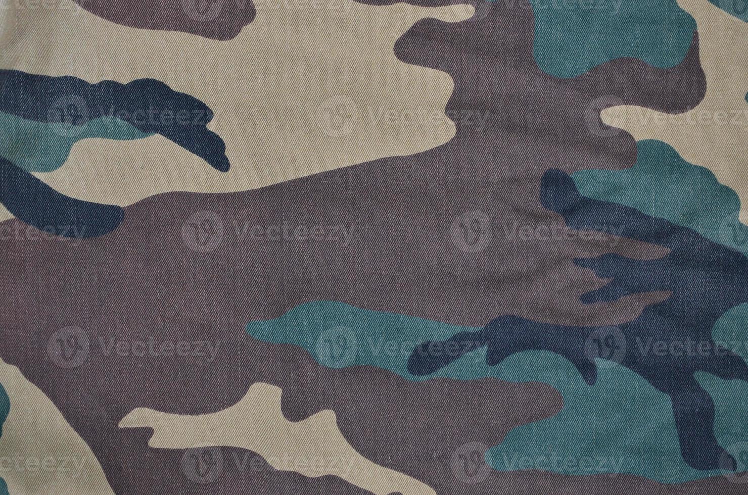 Textile pattern of military camouflage fabric photo