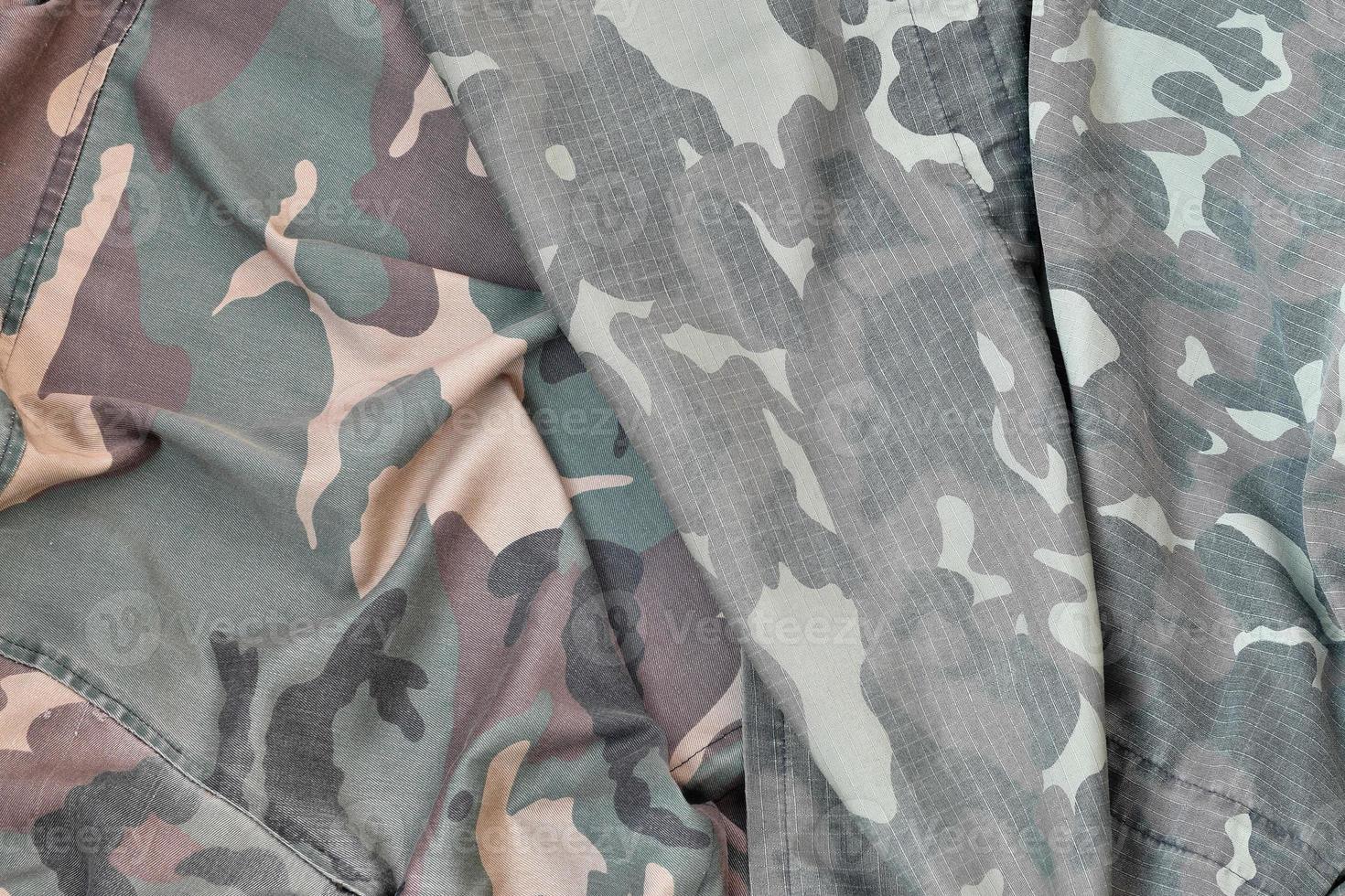 Camouflage background texture as backdrop for army and military design projects photo