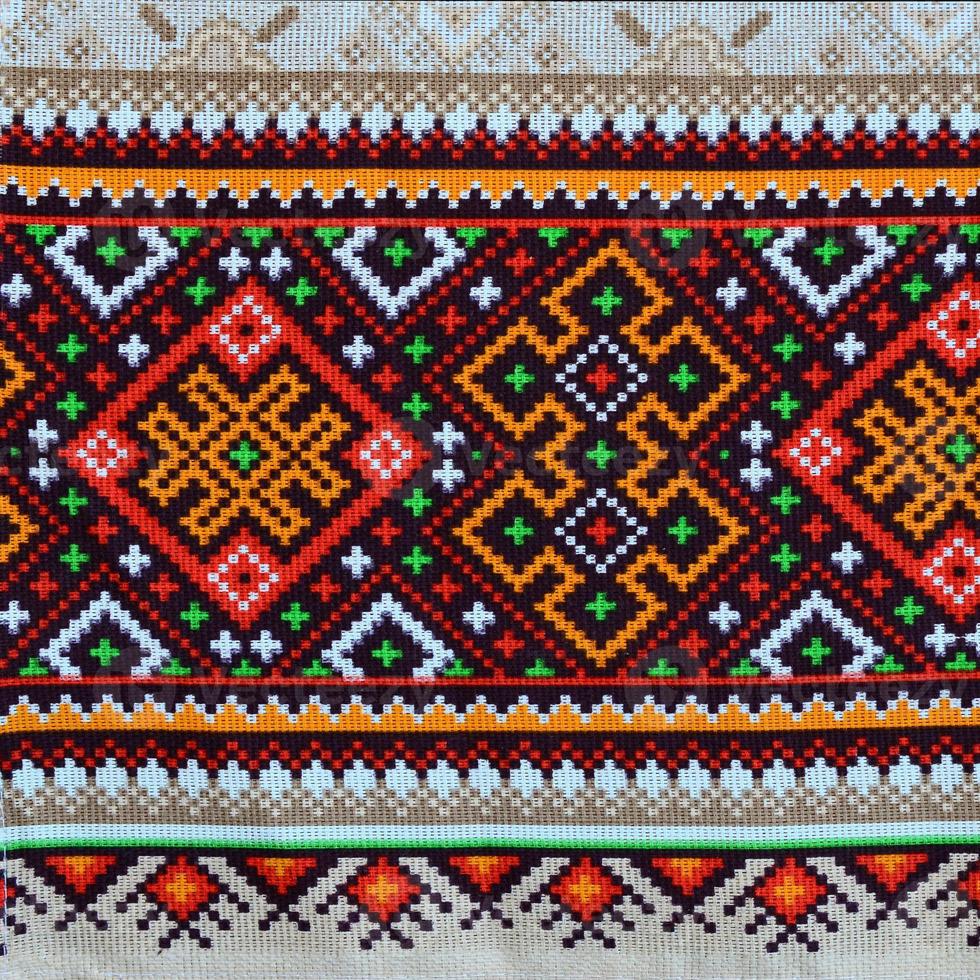 Traditional Ukrainian folk art knitted embroidery pattern on textile fabric photo