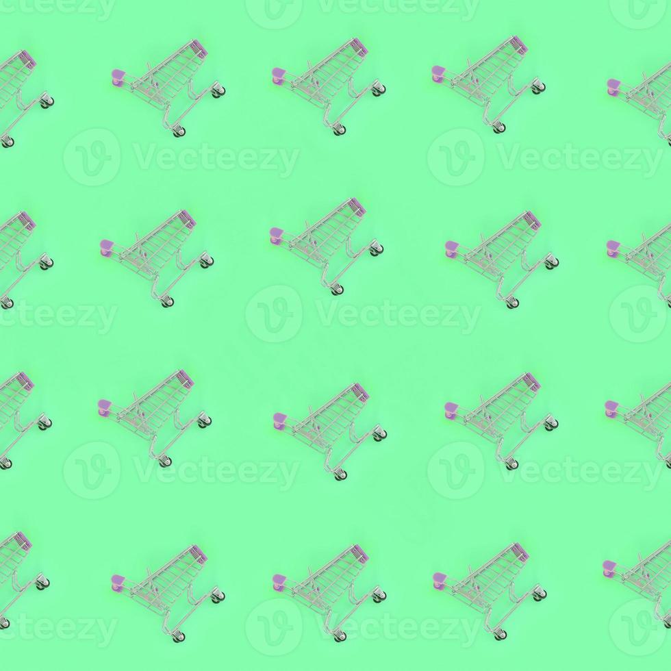 Shopping addiction, shopping lover or shopaholic concept. Many small empty shopping carts perform a pattern on a pastel colored paper background. Flat lay composition, top view photo