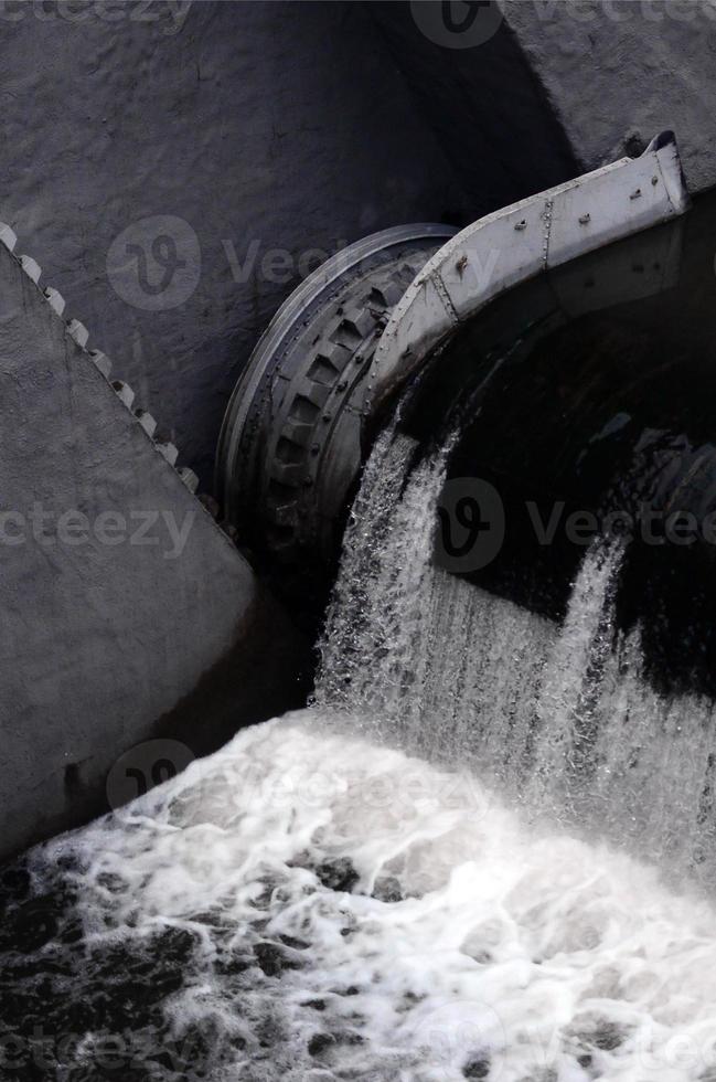 A picture of the flowing water. The dam is designed to regulate the water level in rivers within the city and to provide technical water to industrial objects photo