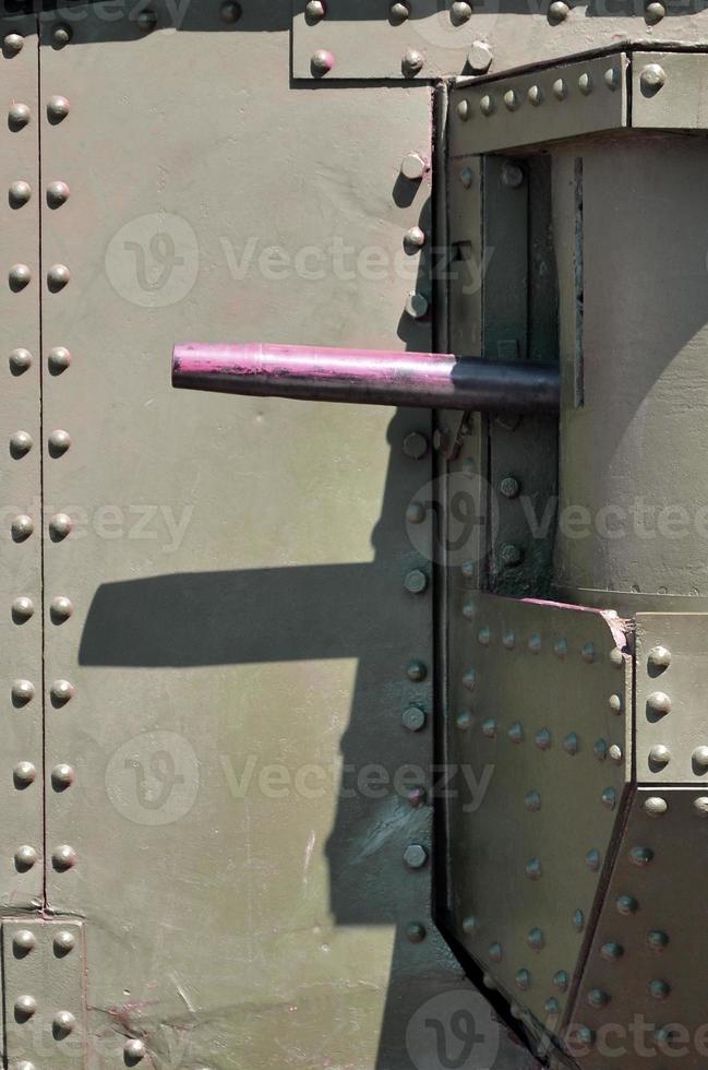 The texture of the wall of the tank, made of metal and reinforced with a multitude of bolts and rivets. Images of the covering of a combat vehicle from the Second World War with a guided machine gun photo