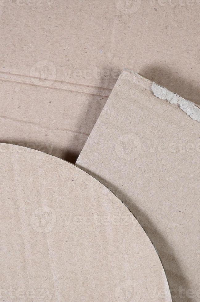 Background image with a lot of beige cardboard paper, which is used to make boxes for the transport of home appliances and postal parcels. Carton texture photo