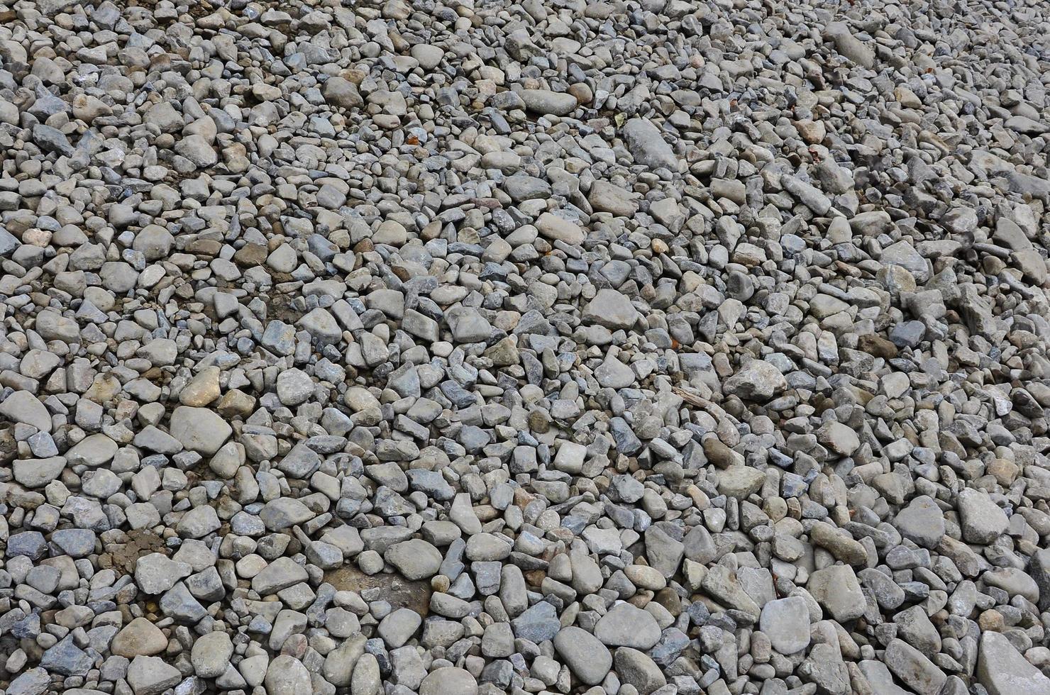 Texture of many crushed stones. Crushed stone is a solid base material for foundation photo