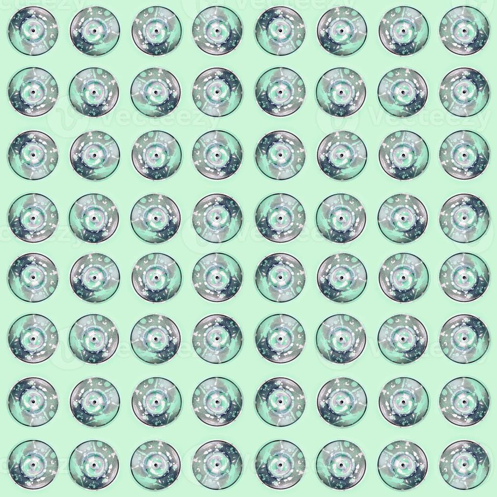 Many used spray cans for graffiti drawing lies on a pastel colored backgroung. Street art painting concept. Minimal flat lay pattern. Top view photo