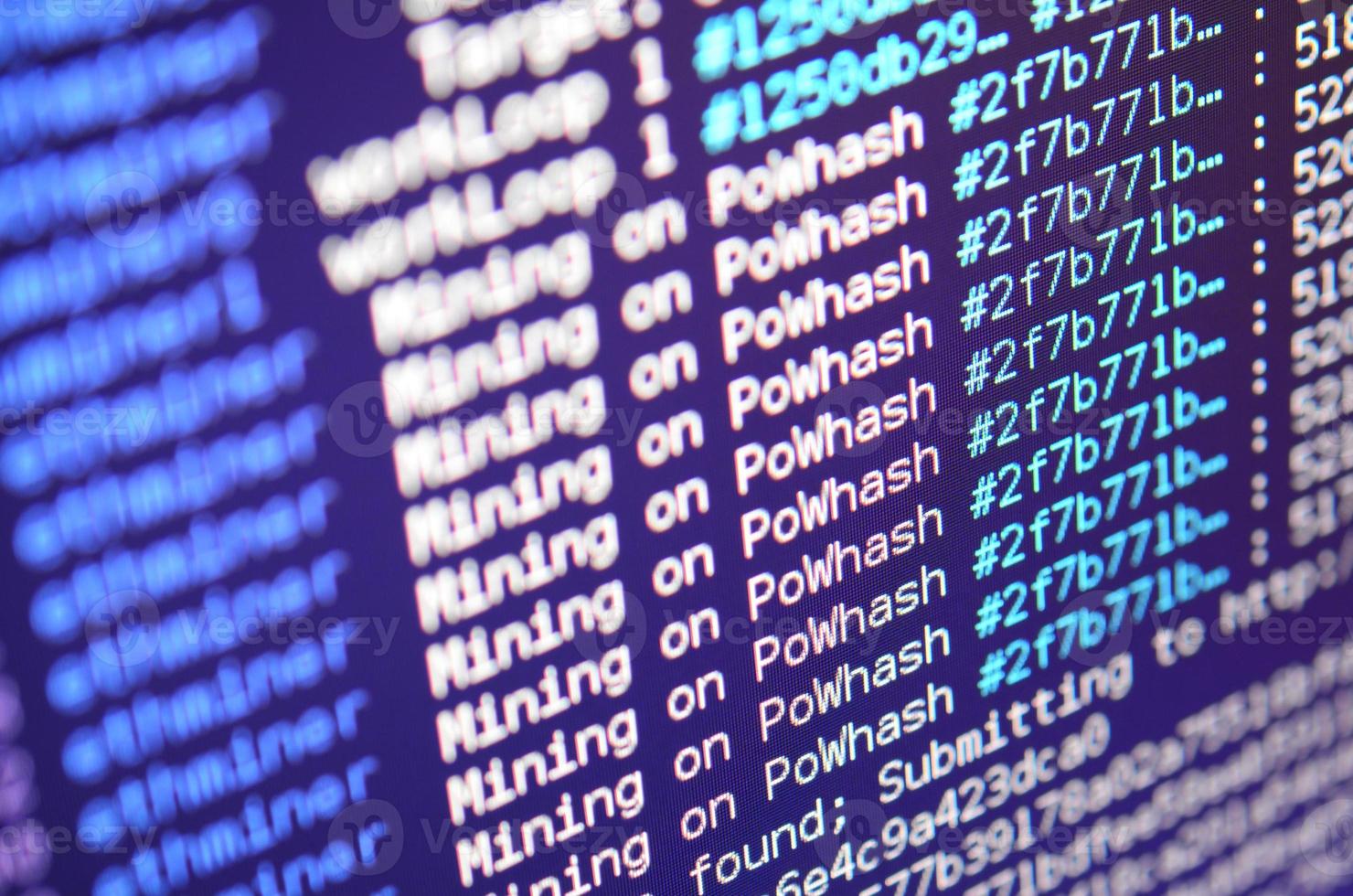 Macro snapshot of the program interface for crypto currency mining on the monitor of an office computer. The concept of mining bitcoins. The flow of information strings and data photo