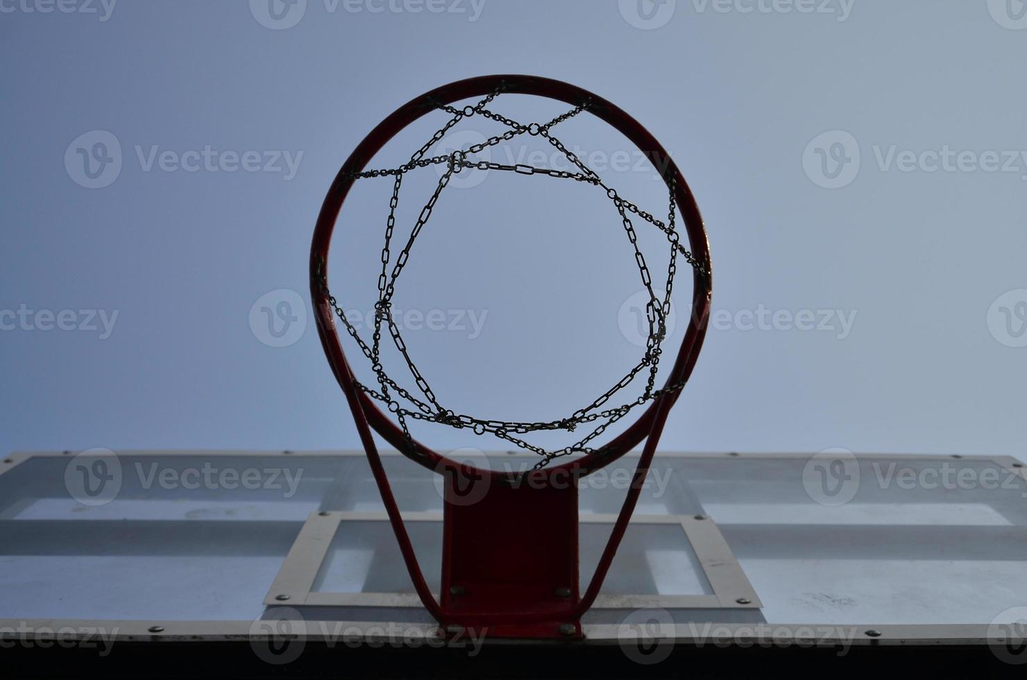 Outdoor Basketball backboard with clear blue sky photo