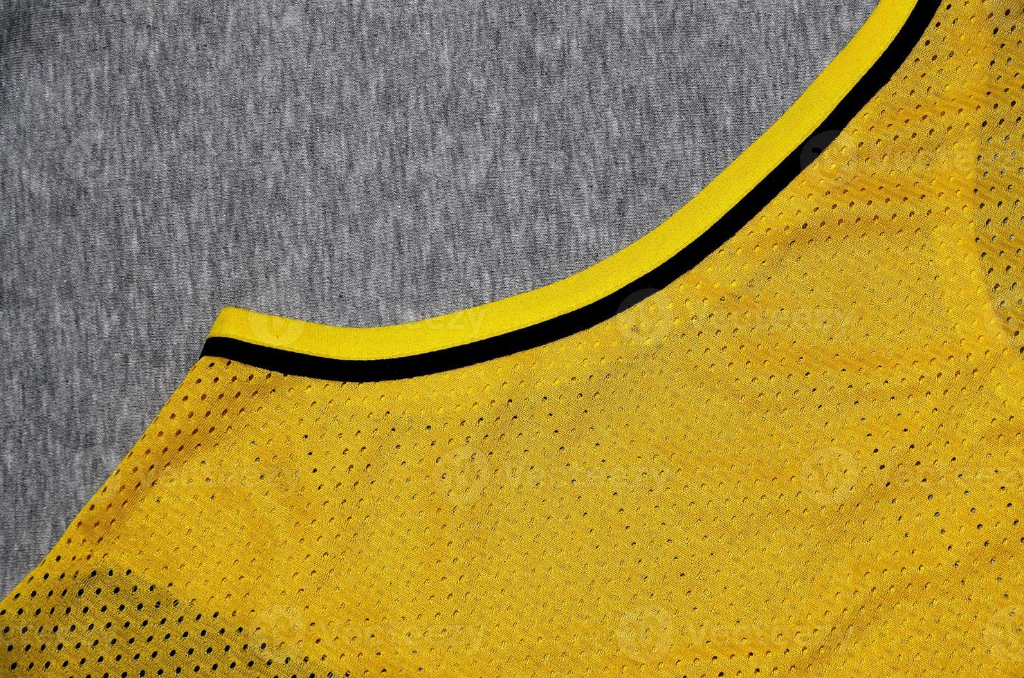 Top view of cloth textile surface. Close-up rumpled heater and knitted fabric texture with a thin striped pattern. Sport clothing fabric texture. Colored basketball shirt and heater hoodie photo