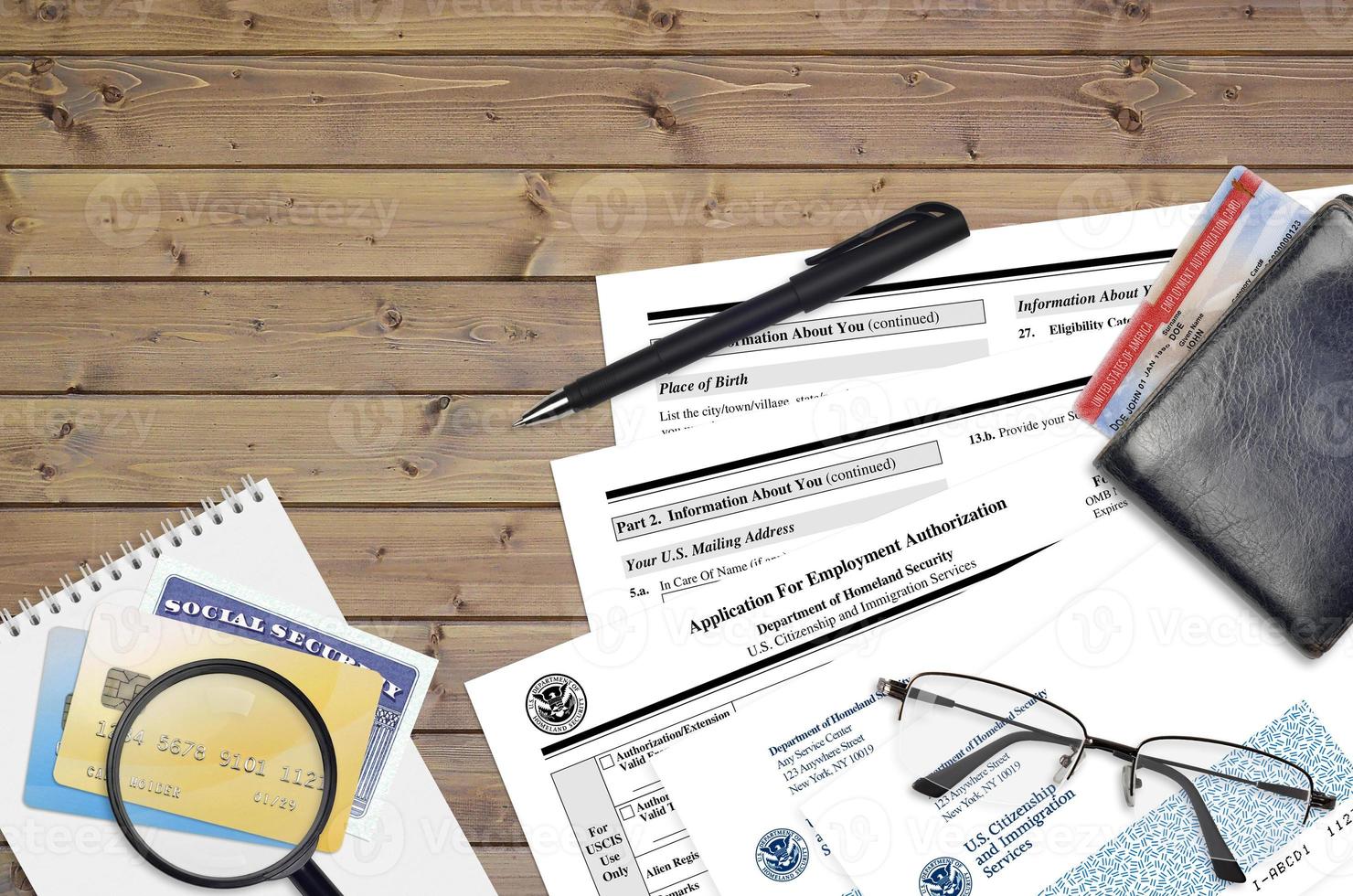 USCIS form I-765 Application for employment authorization lies on flat lay office table and ready to fill. U.S. Citizenship and Immigration services paperwork concept photo