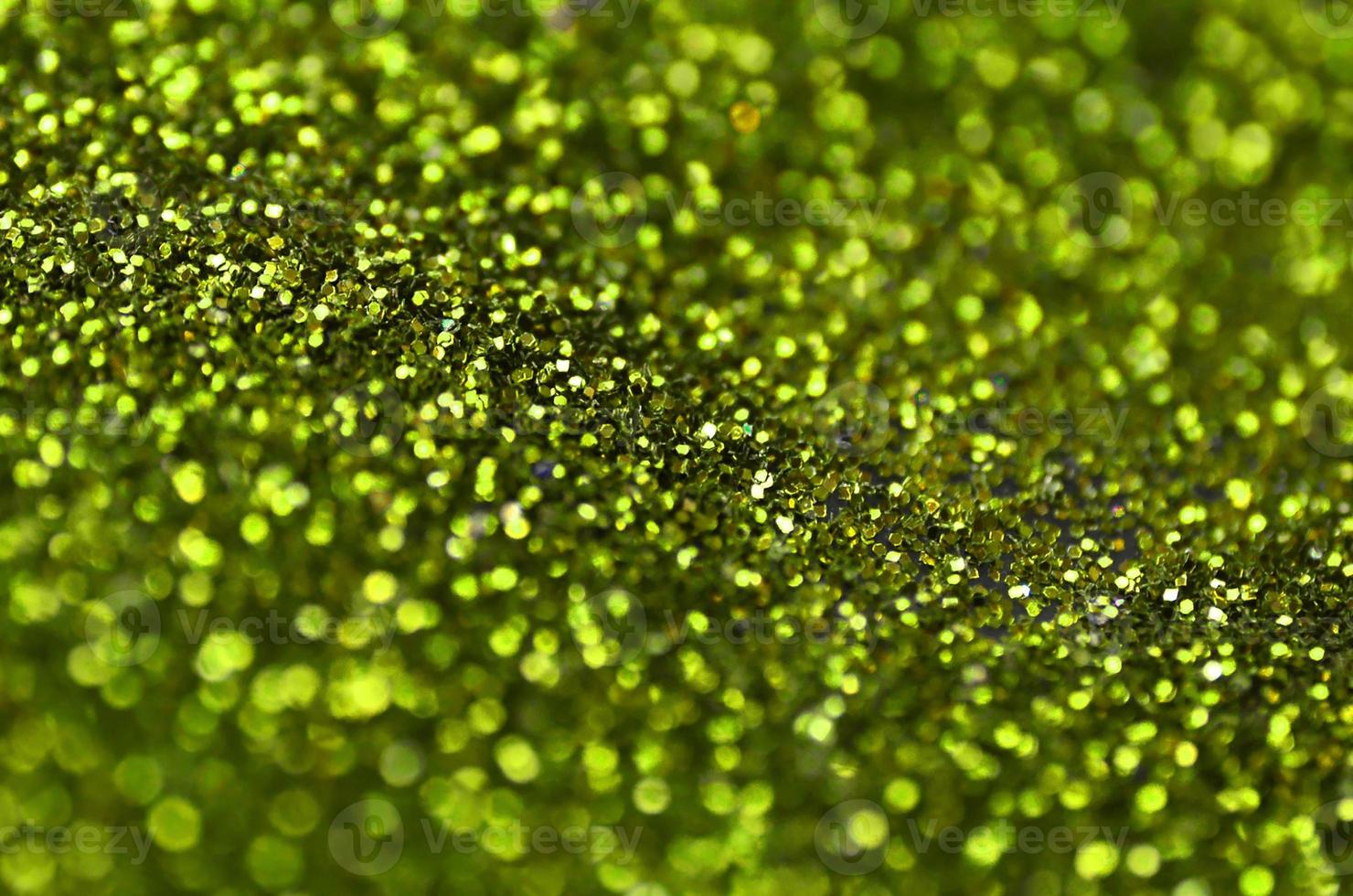 Lentejuelas decorativas verde lima. imagen de fondo con luces bokeh brillantes de elementos pequeños foto