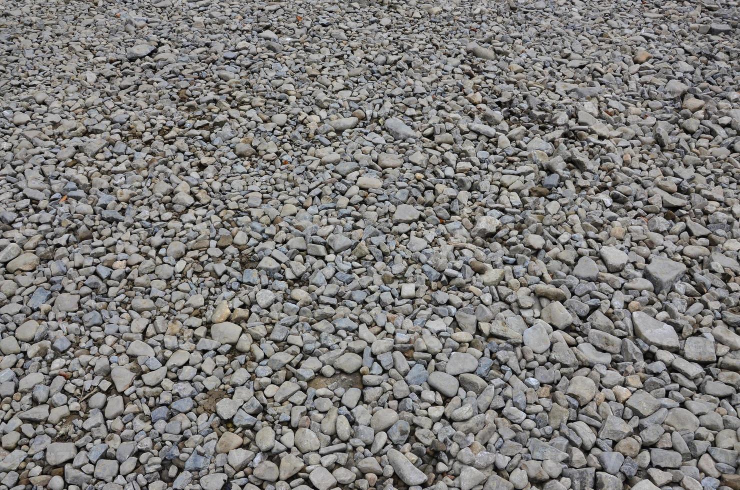 Texture of many crushed stones. Crushed stone is a solid base material for foundation photo