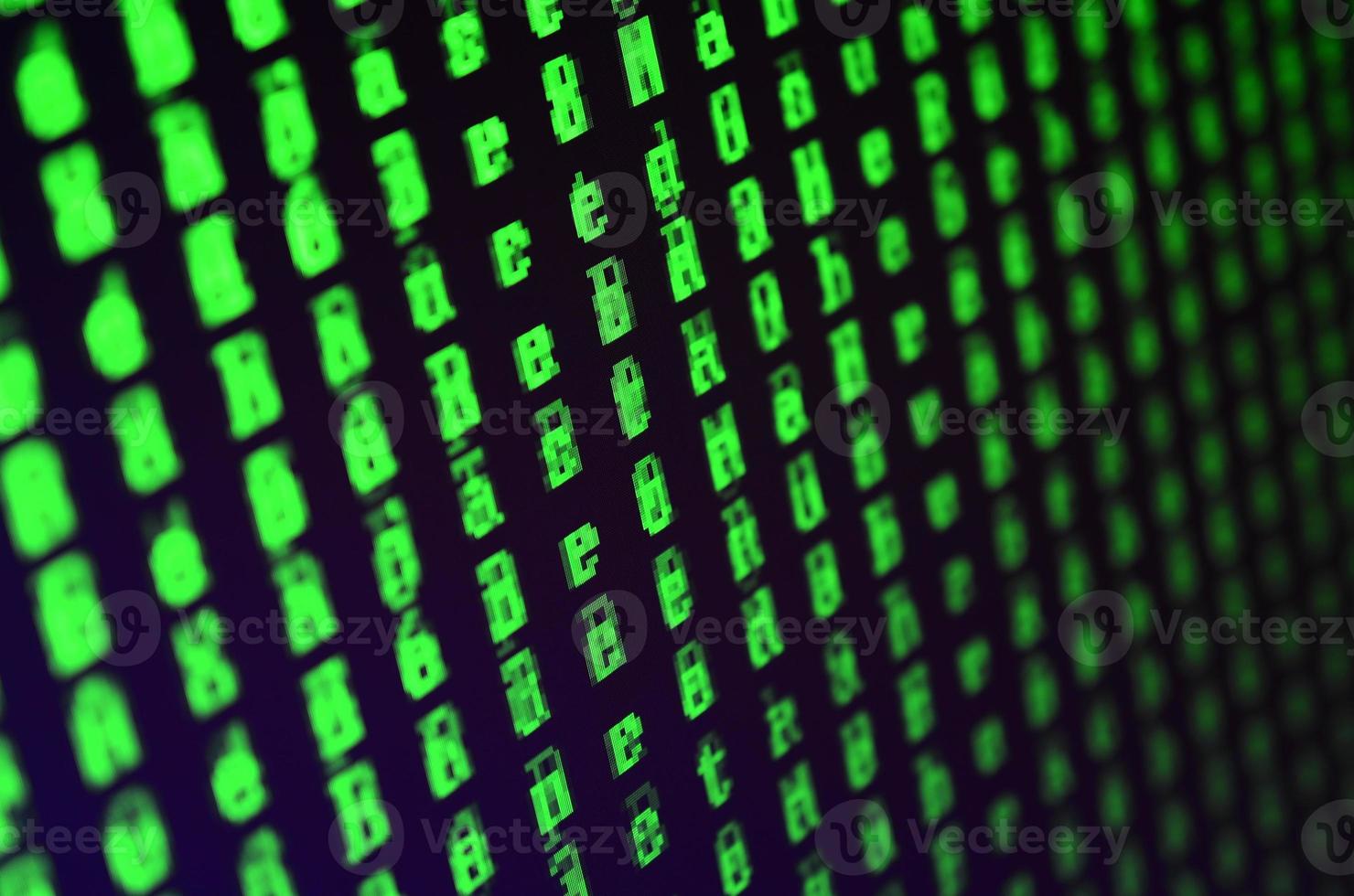 Macro shot of a glitch on the monitor of an office computer. The concept of introducing a virus into a personal data keeper. Stream of random green symbols on a black background photo