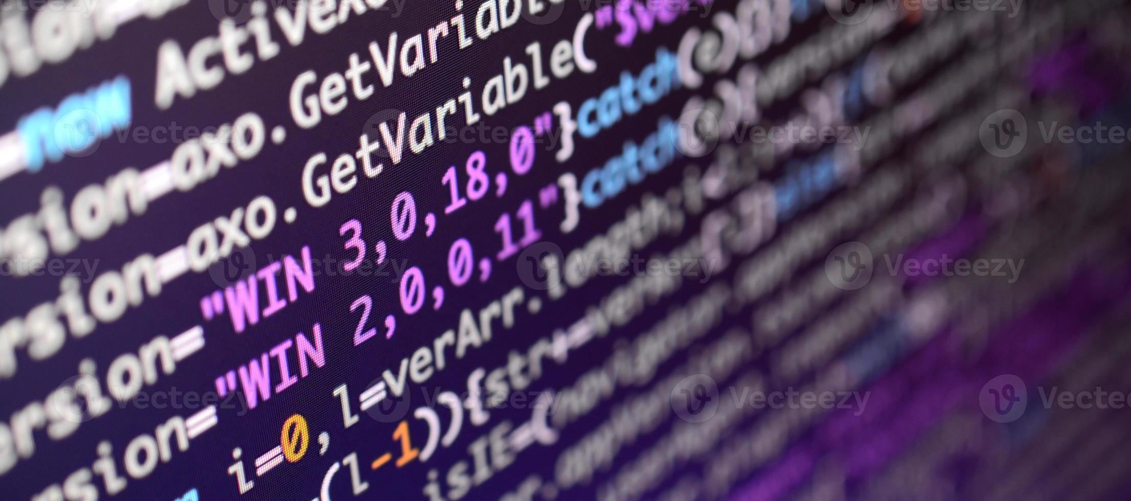 Macro shot of the command line on the monitor of the office computer. The concept of the programmer's work. Information line flow photo