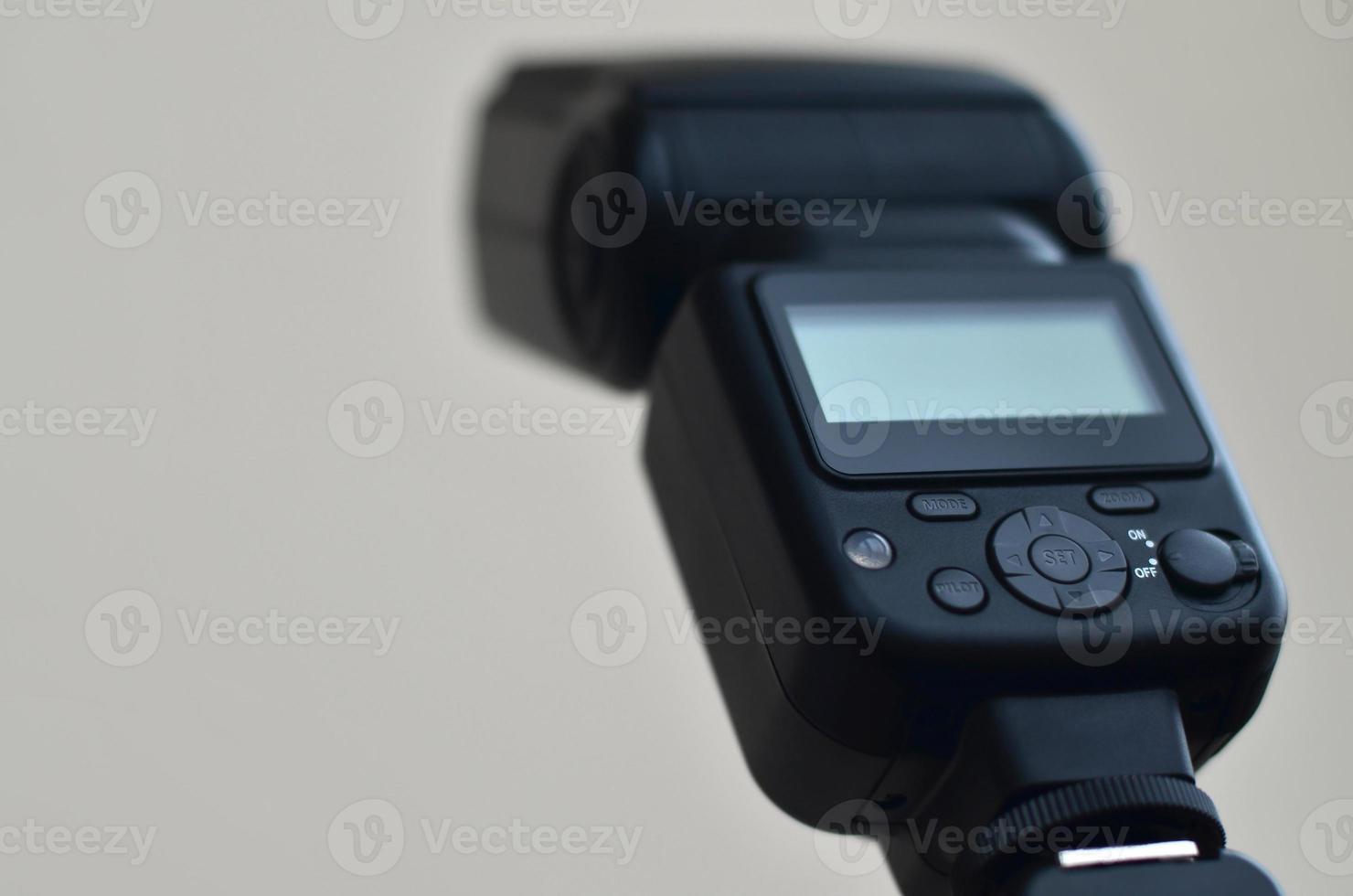 Speedlight gun with trigger set mounted on tripod photo
