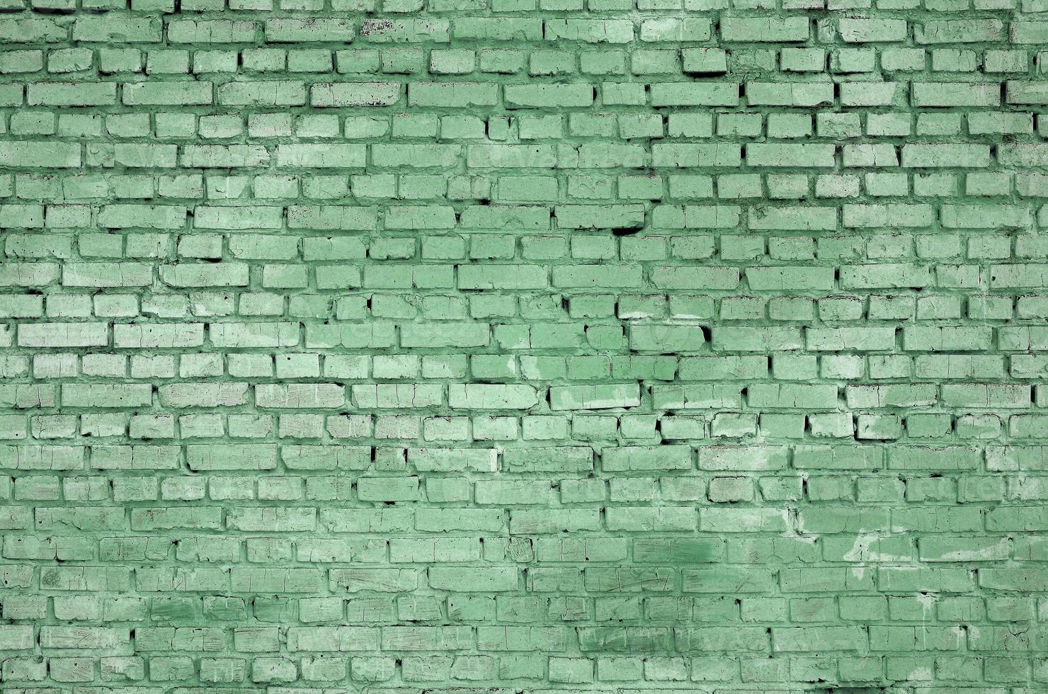Square brick block wall background and texture. Painted in green photo
