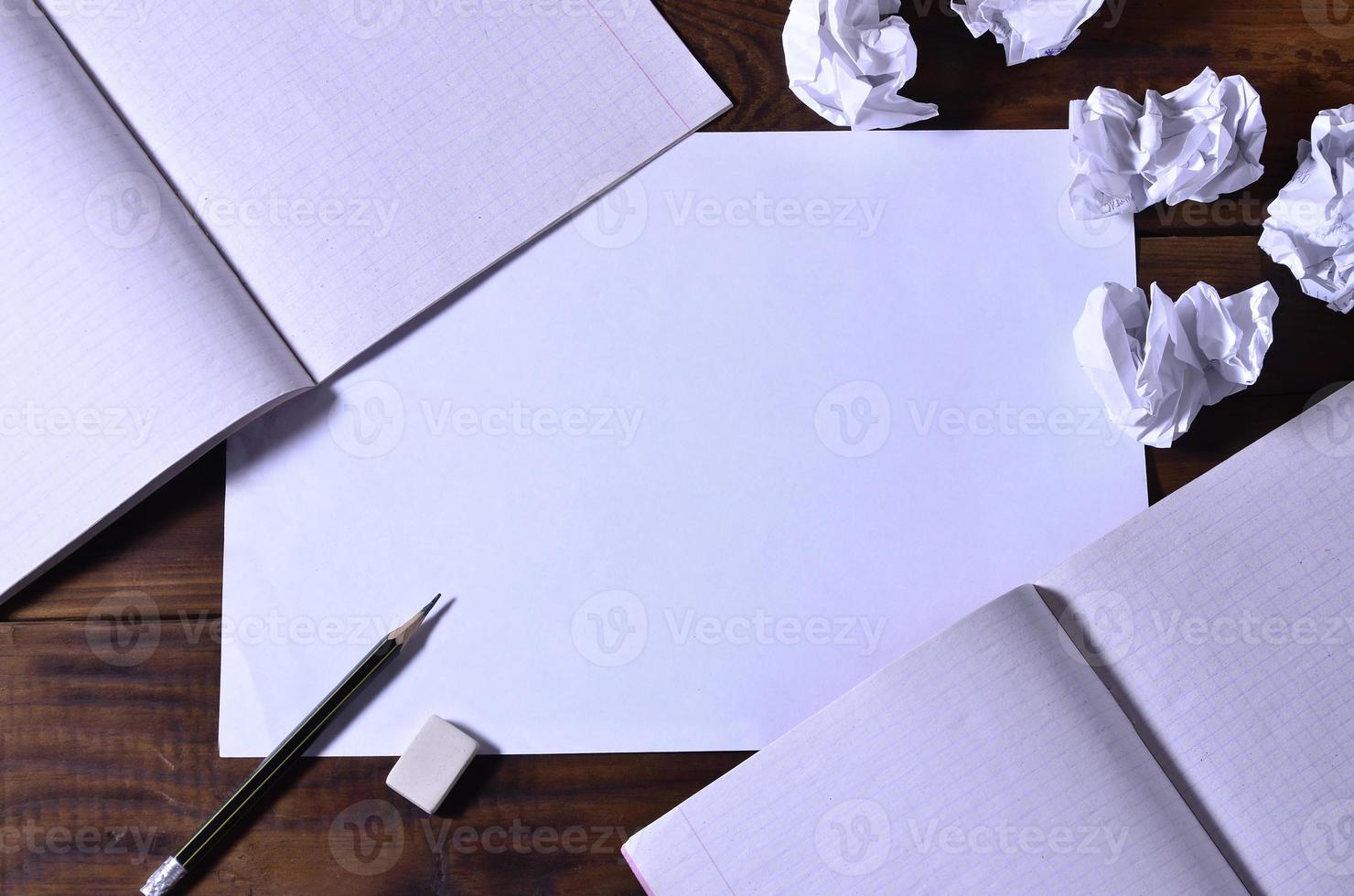 Photo of a clean white school checkbook on a brown wooden background. Idea or message concept. Plenty of space for text