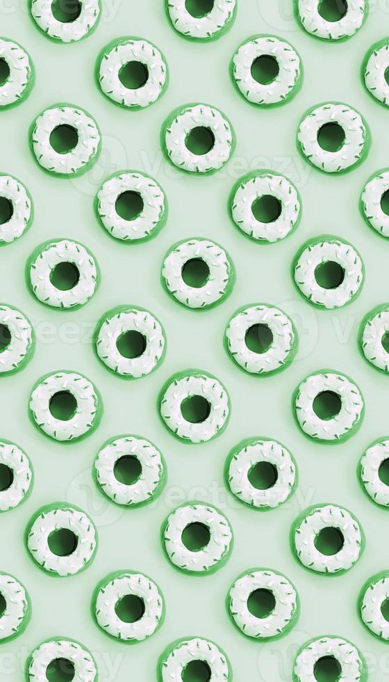 Many small plastic donuts lies on a pastel colorful background. Flat lay minimal pattern. Top view photo