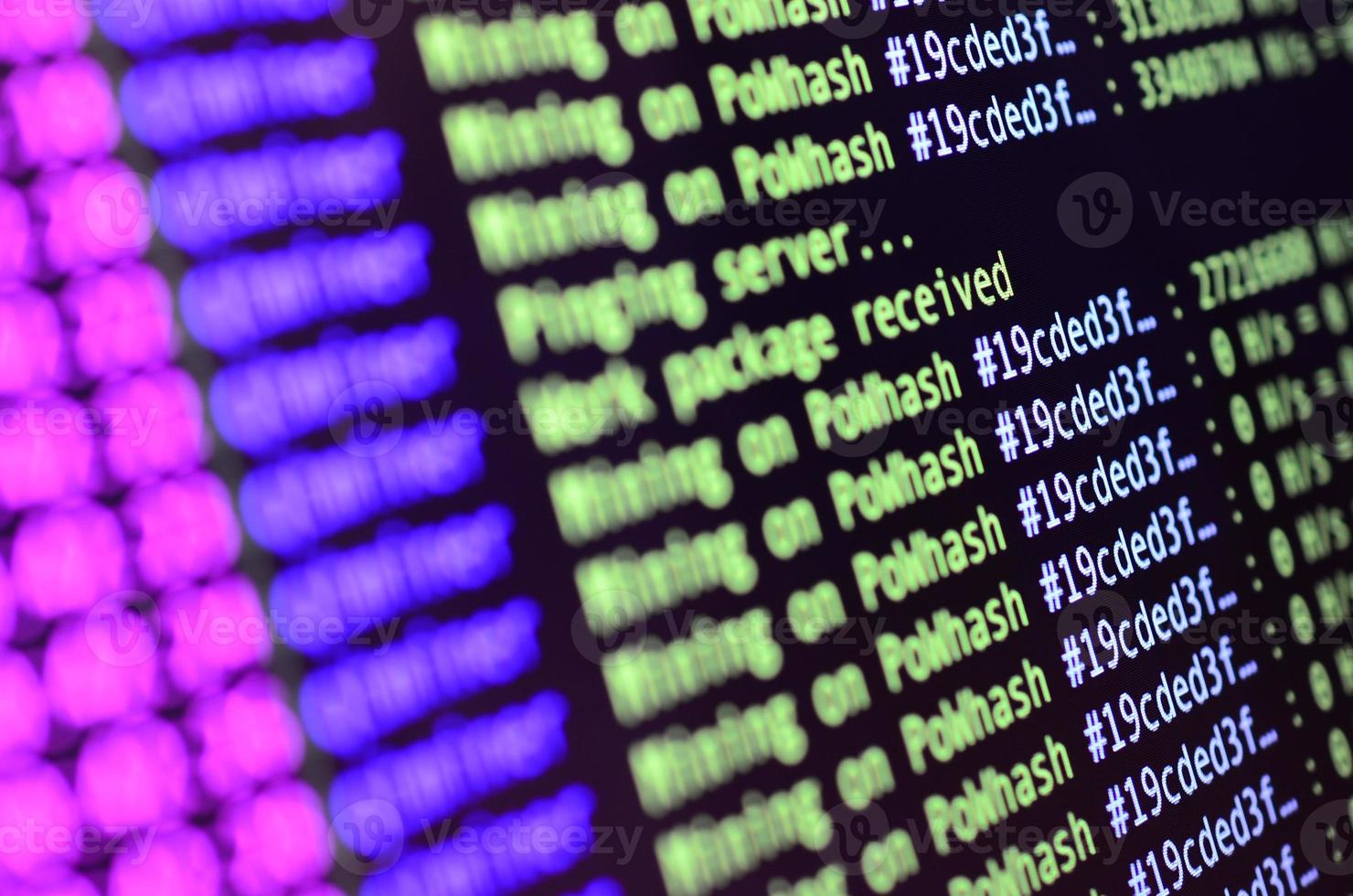 Macro snapshot of the program interface for crypto currency mining on the monitor of an office computer. The concept of mining bitcoins. The flow of information strings and data photo