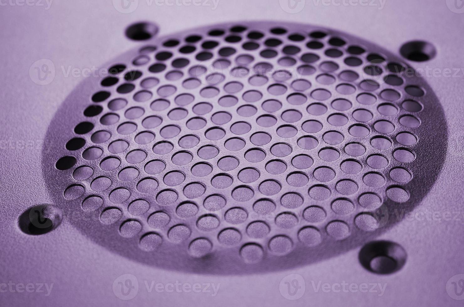 Close-up, shallow focus of a meshed style cooling panel used on a main frame computer. The circular holes aid active venting of hot air within computer photo
