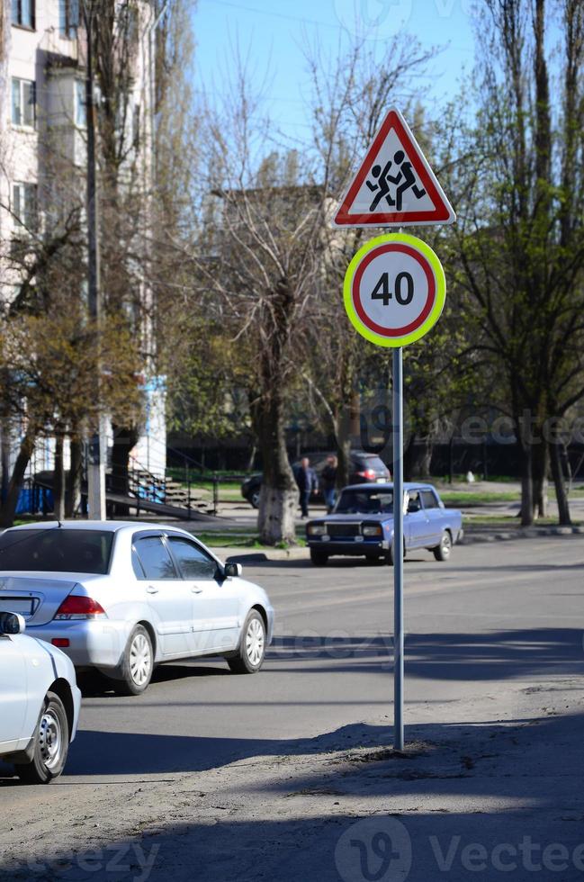 Road sign with the number 40 and the image of the children who run across the road photo