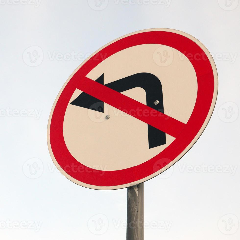 Turn left is prohibited. Traffic sign with crossed out arrow to the left photo