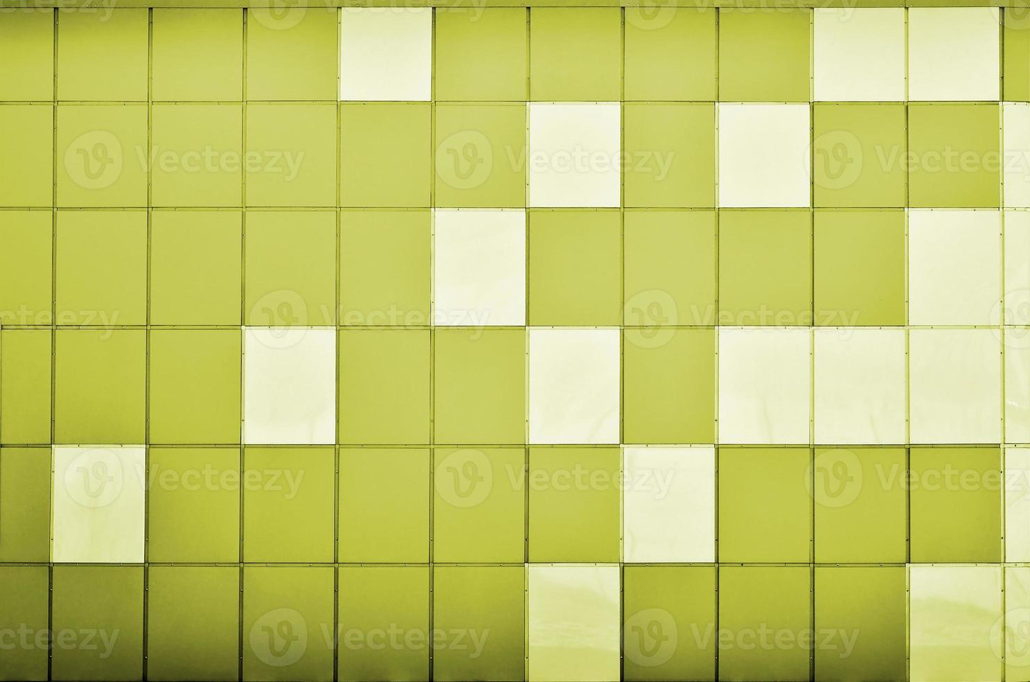 The texture of the metal wall, framed in the form of colored squares of two colors. Modern wall design for the exterior of residential and office buildings photo