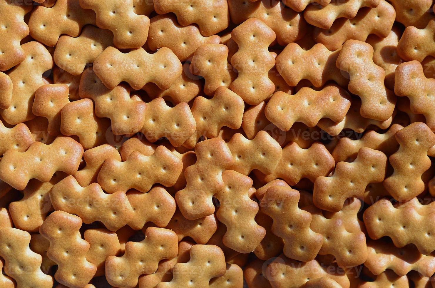 Pattern of a many yellow salted crackers photo