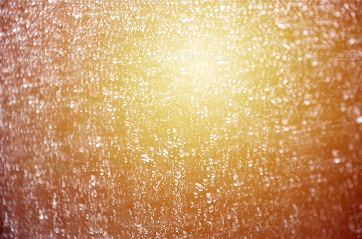 Background image of rain drops on a glass window. Macro photo with shallow depth of field. Toned picture